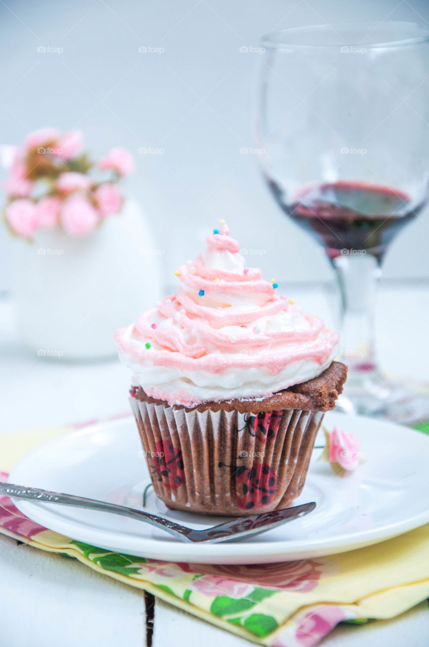 Pink cupcake on plate