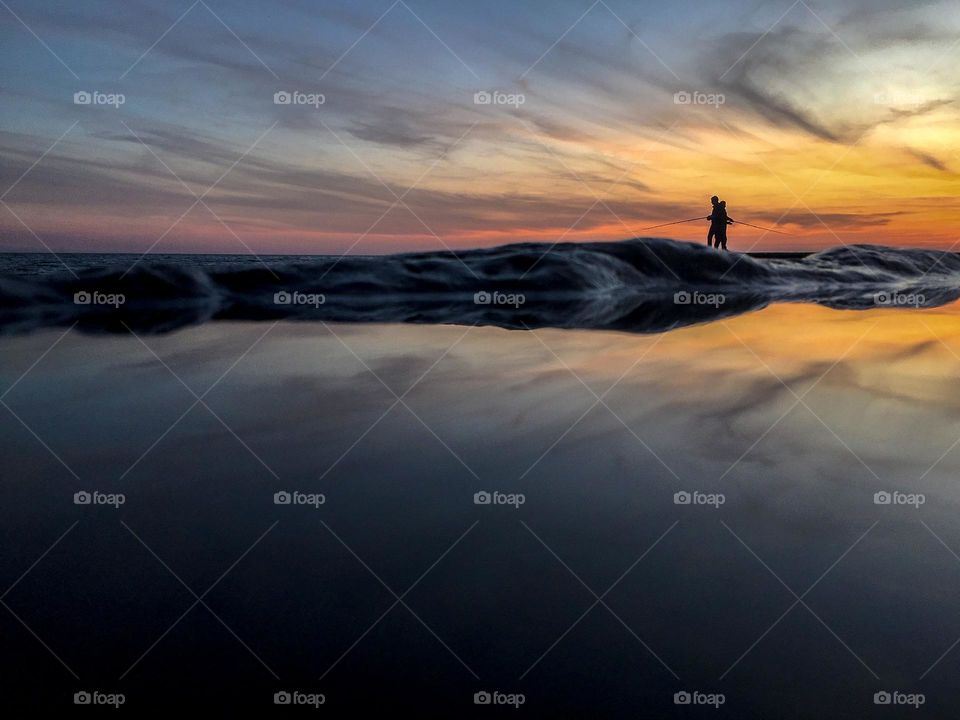 Two fishermen fishing in Crimea.