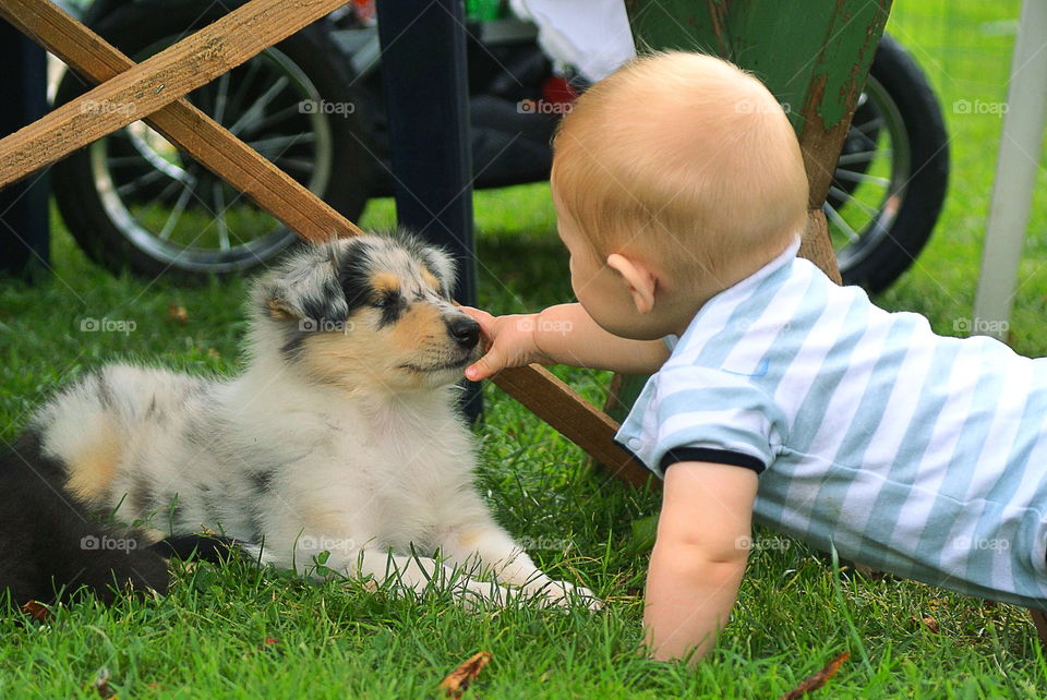 Baby boy and a puppy