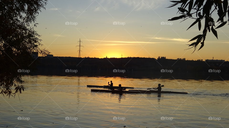 on a kayak on the lake at sunset