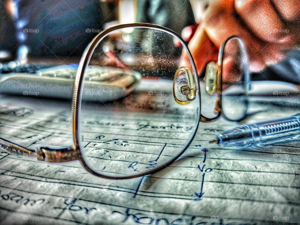 spectacle, calculator and a pen.