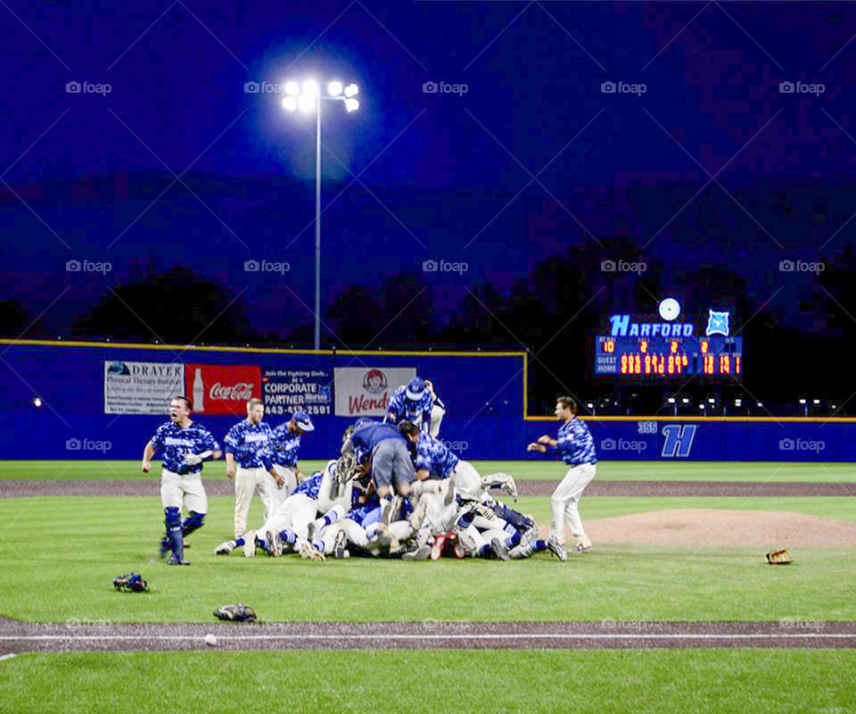 Divisional win. college players rush the field after amazing come back for divisional win!