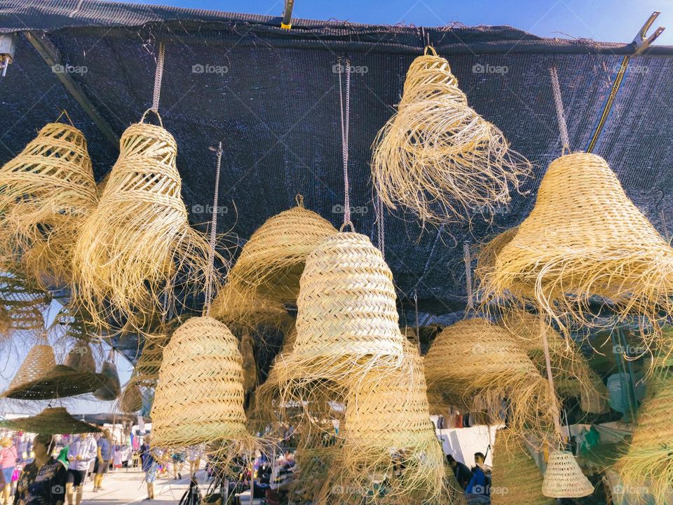 Straw lampshades at the market