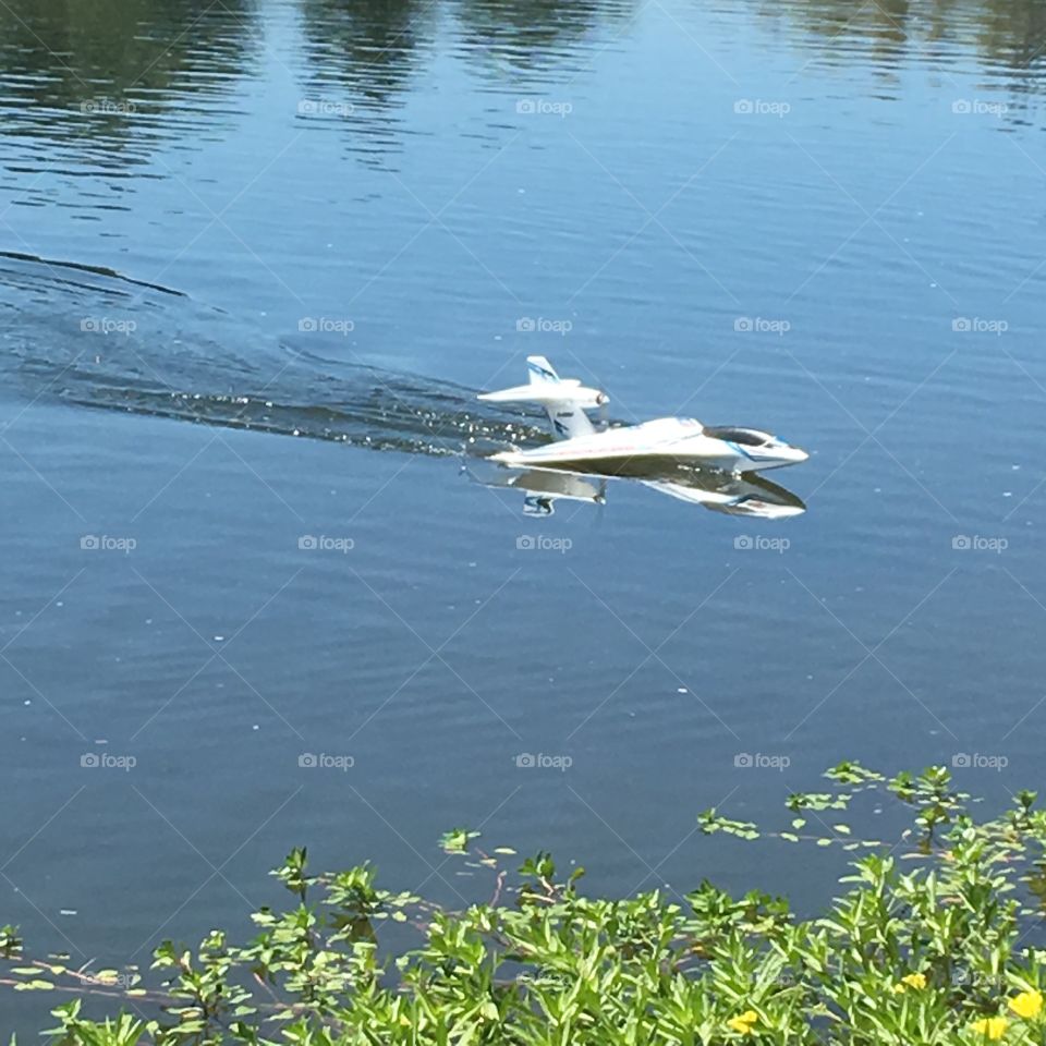 Motorised miniature watercraft airplane on water