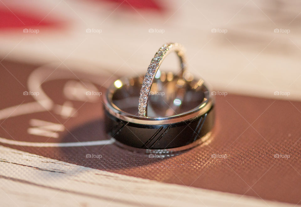 Brides diamond band inside of grooms black band