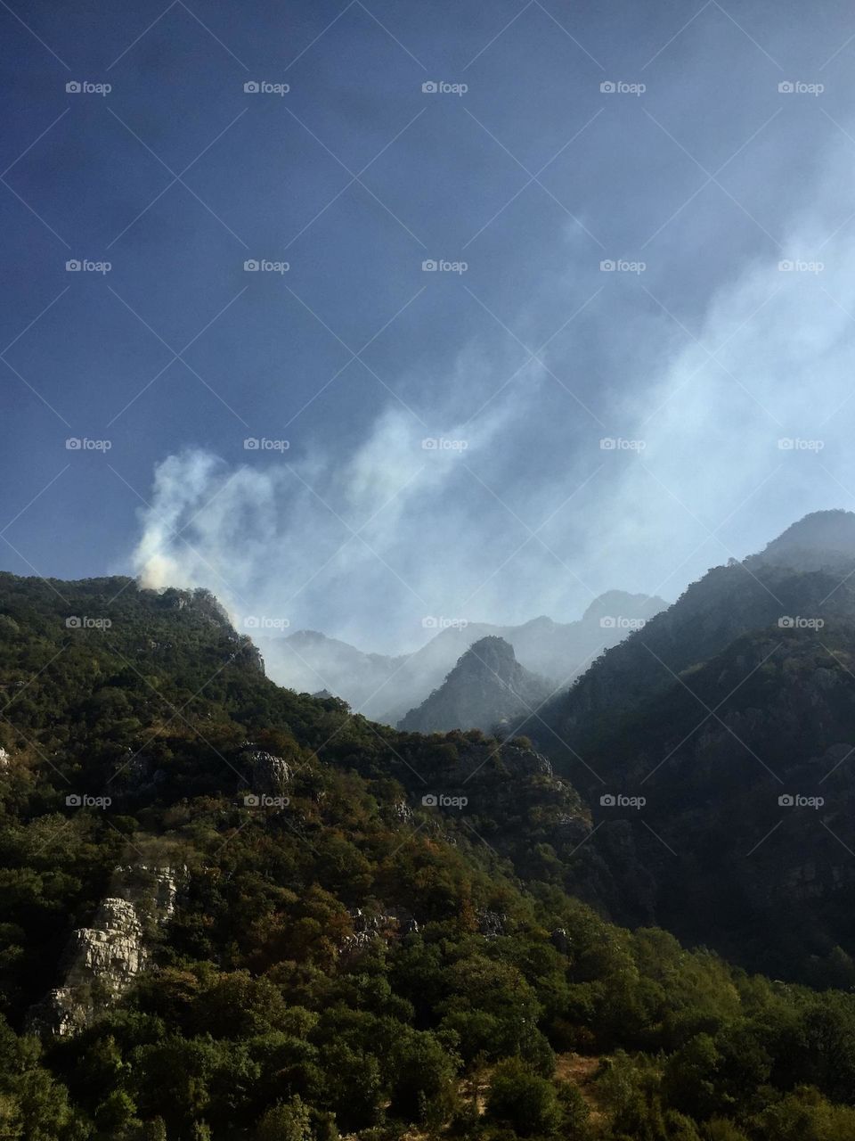 High mountains in Montenegro covered in a white fog