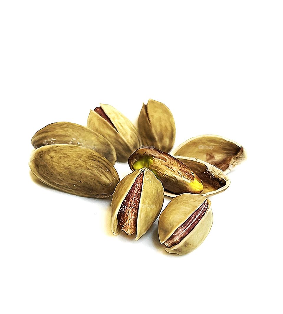 Pistachios taken close-up on a white background