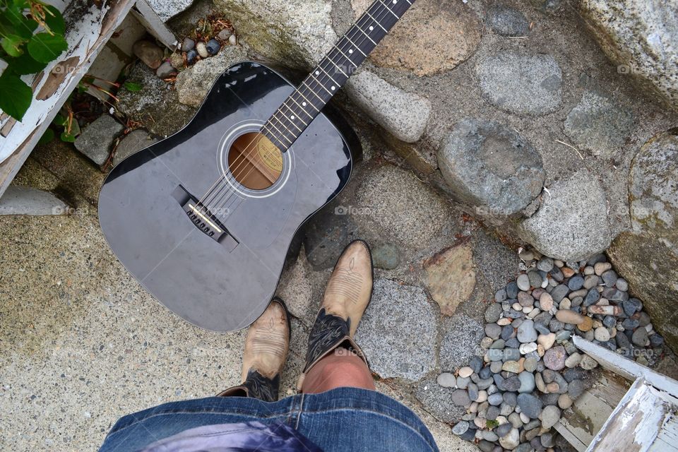 From where I stand in cowboy boots with guitar as I climb outdoor stairs and prepare for a Nashville trip