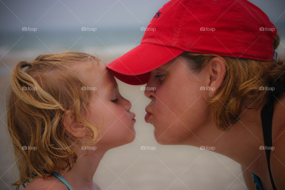 Mother and Daughter Kiss
