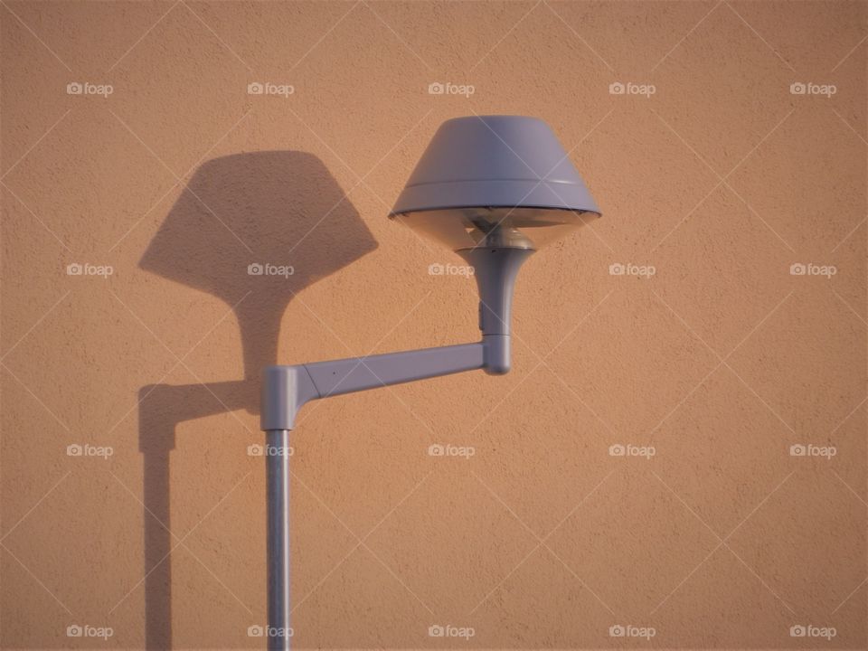 Lamp post by wall