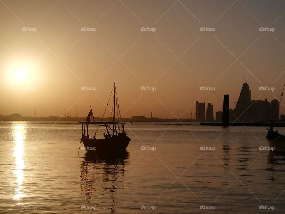 a small ship is floating in the sea