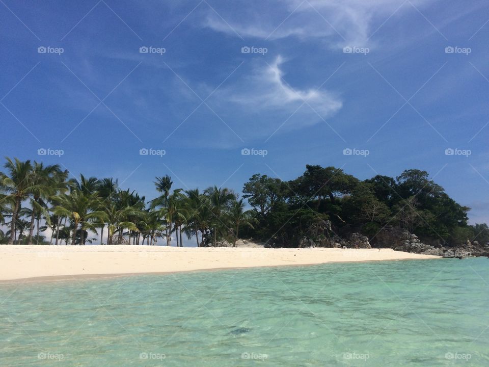 Clear waters in a white sand beach