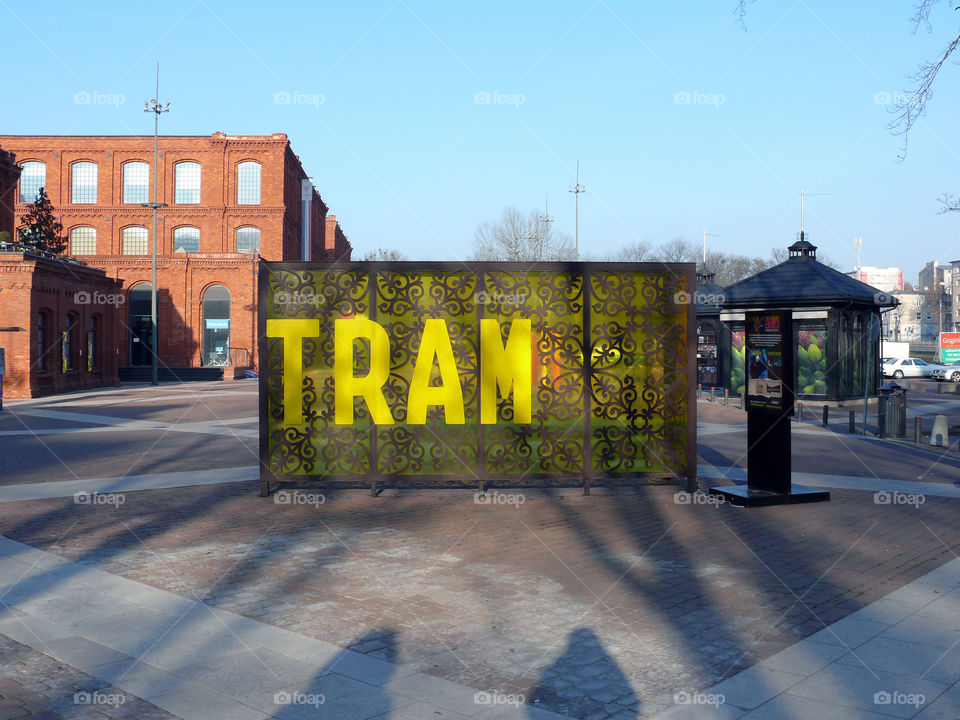 Yellow tram shelter in Łódź, Poland.