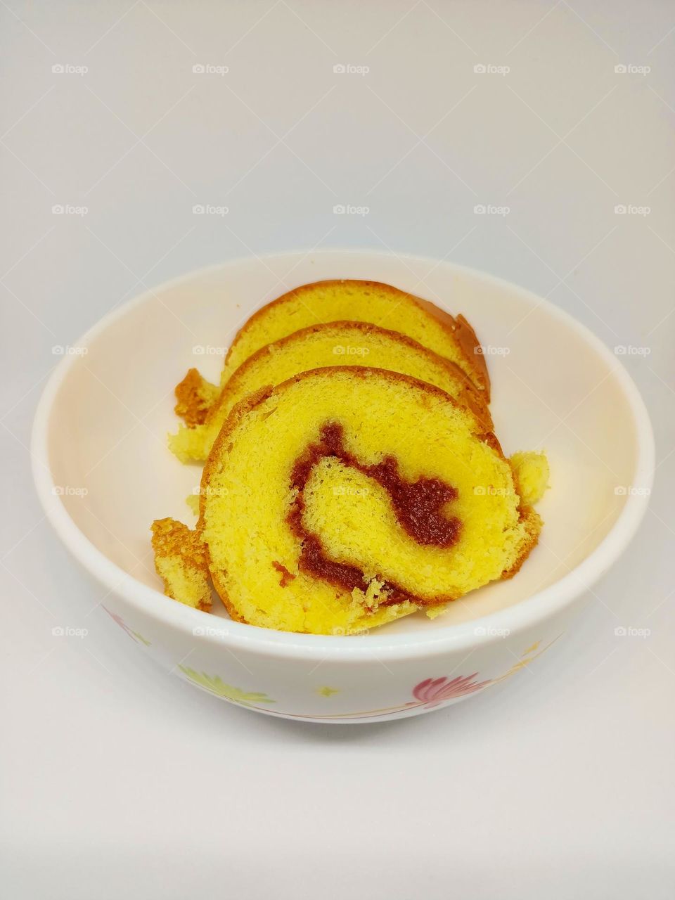 Yellow jam roll cakes isolated set on white background