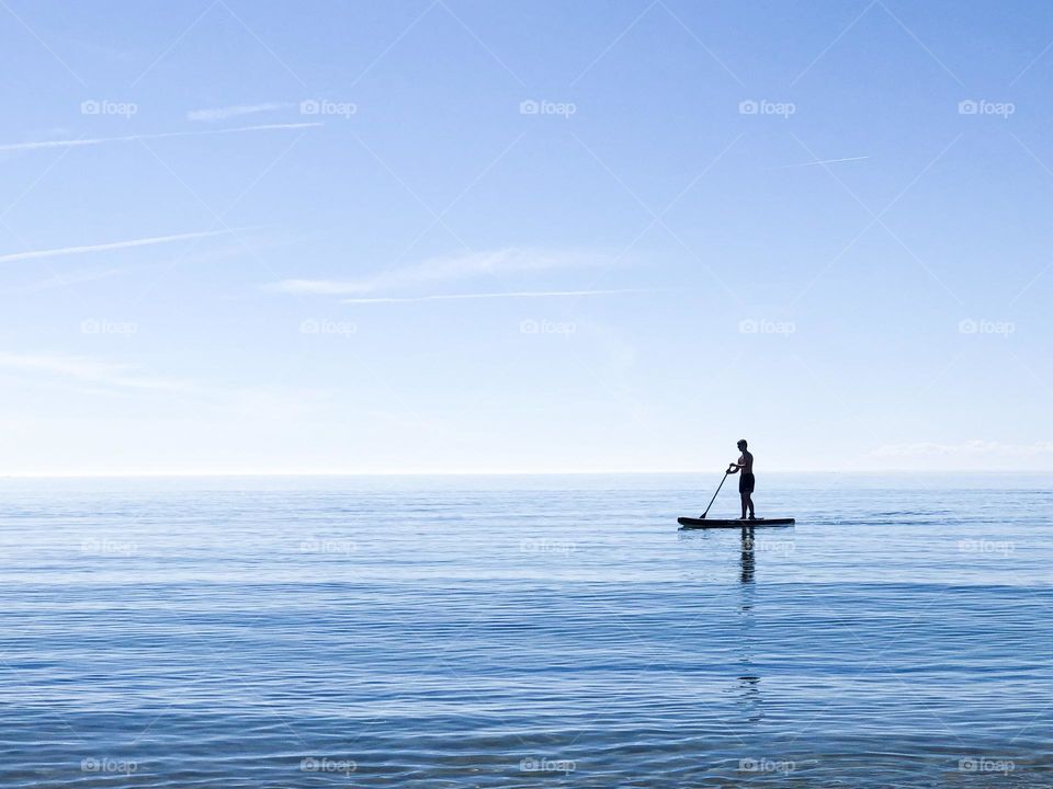 Silhouette of a person on a SUP