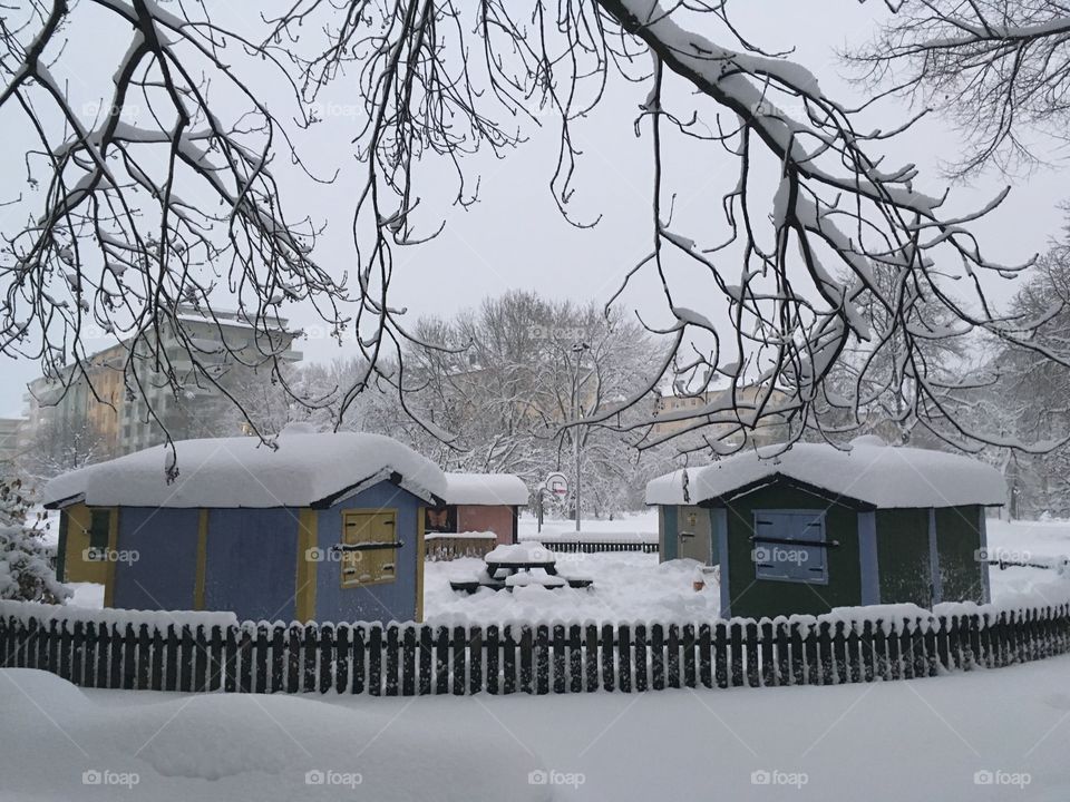 Playhouses covered in snow 