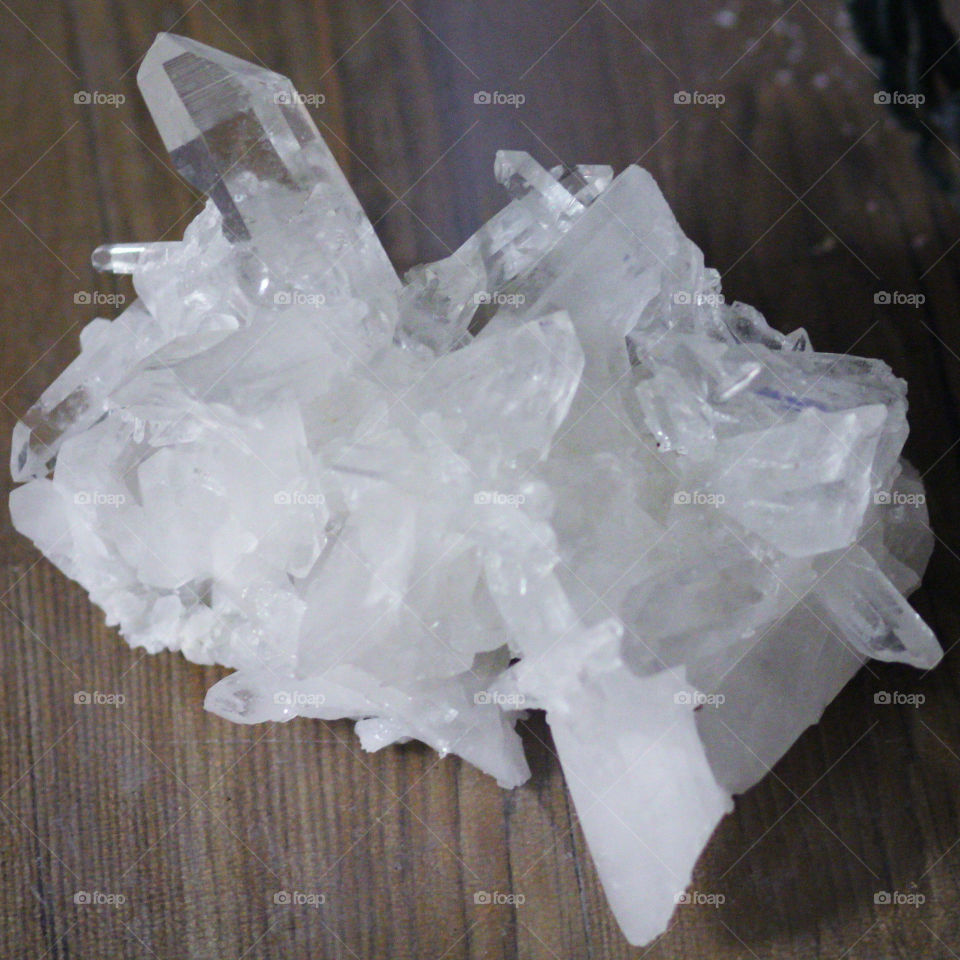 Quartz Crystal for healing sitting on a table.