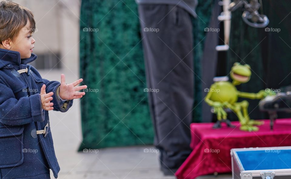 Close-up of a boy clapping hands