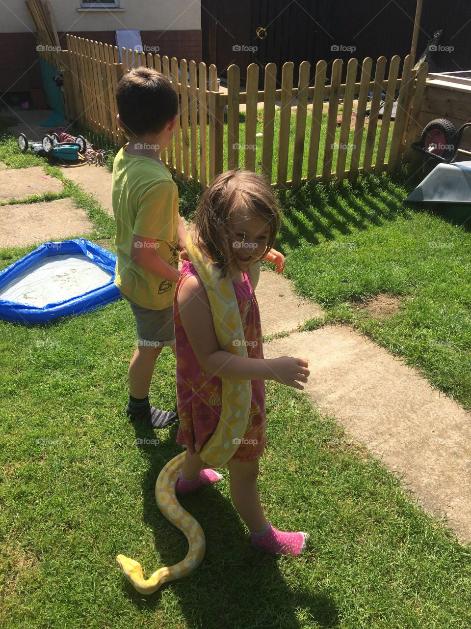 Holding the snake in the garden