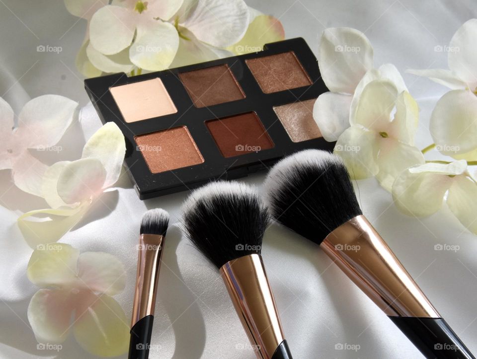 Makeup still life eye shadow and makeup brushes 