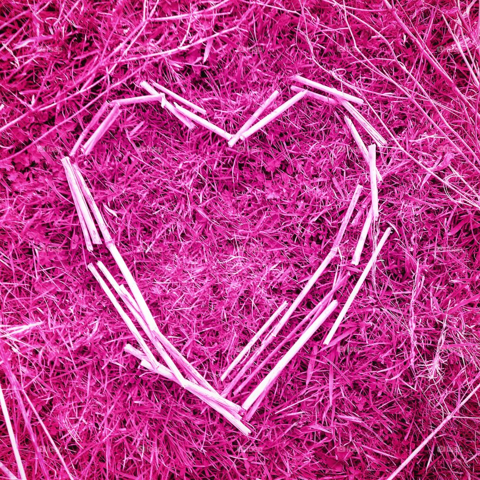 Pink heart made with straw