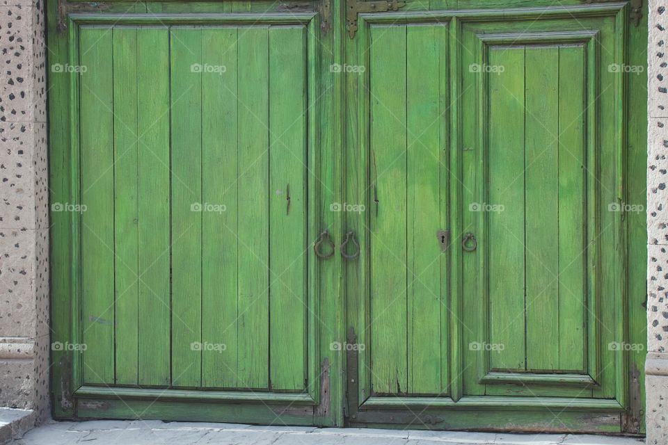 Closeup colorful green doorway in San Miguel de Allende, Mexico