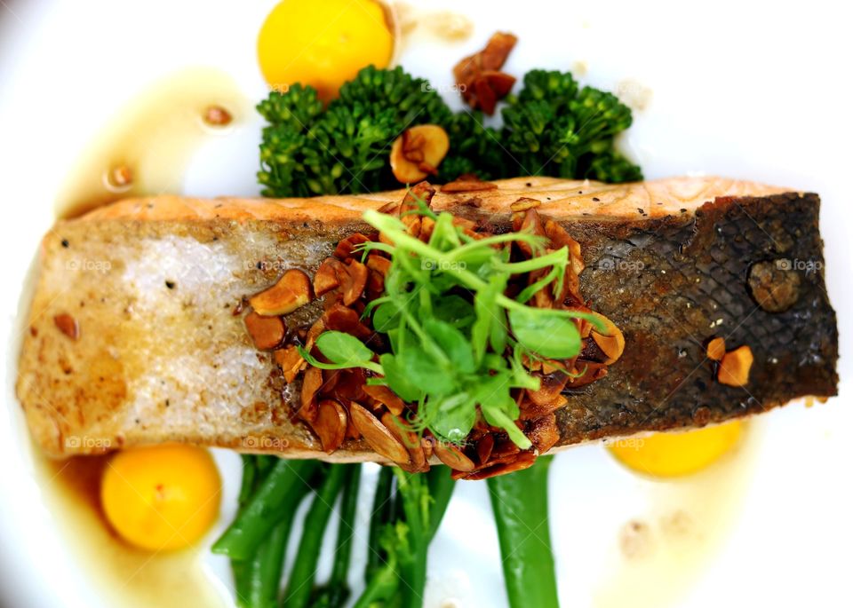 Food, crispy skinned fresh salmon, tender stem broccoli & toasted almond butter