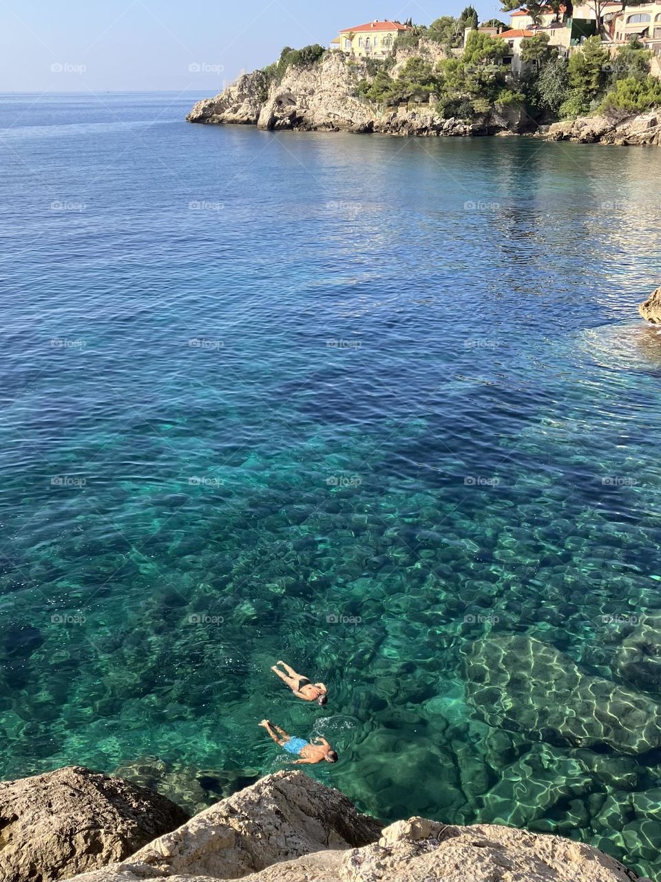 Swimmers in Blue sea