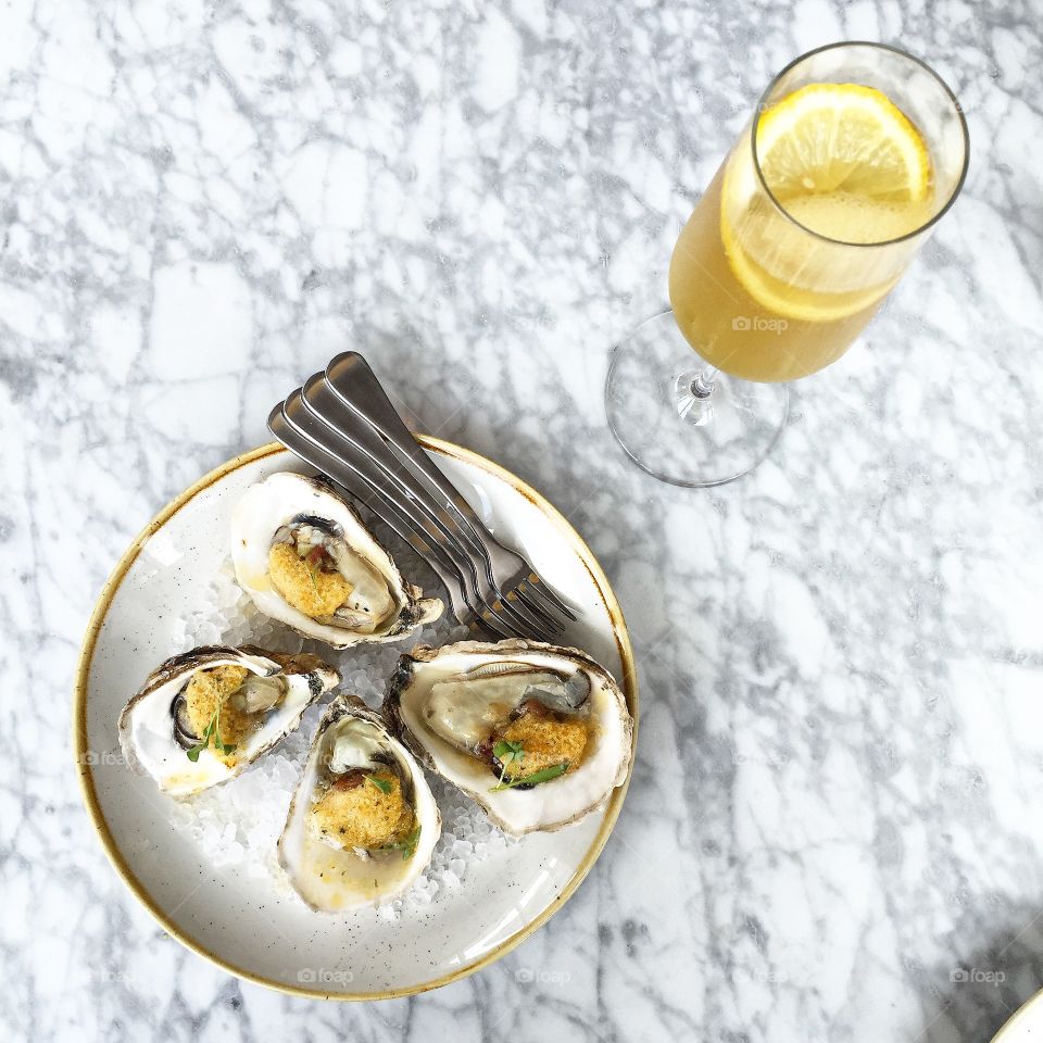 Baked oysters and French 75 at VOX Table in Austin