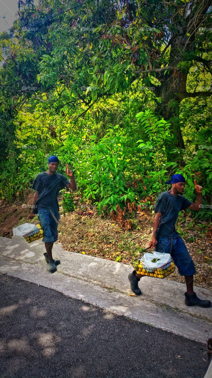 i was on the jeep ride Antiqua and this islander was walking with fruit down the road..I actually made the second guy..I like this picture