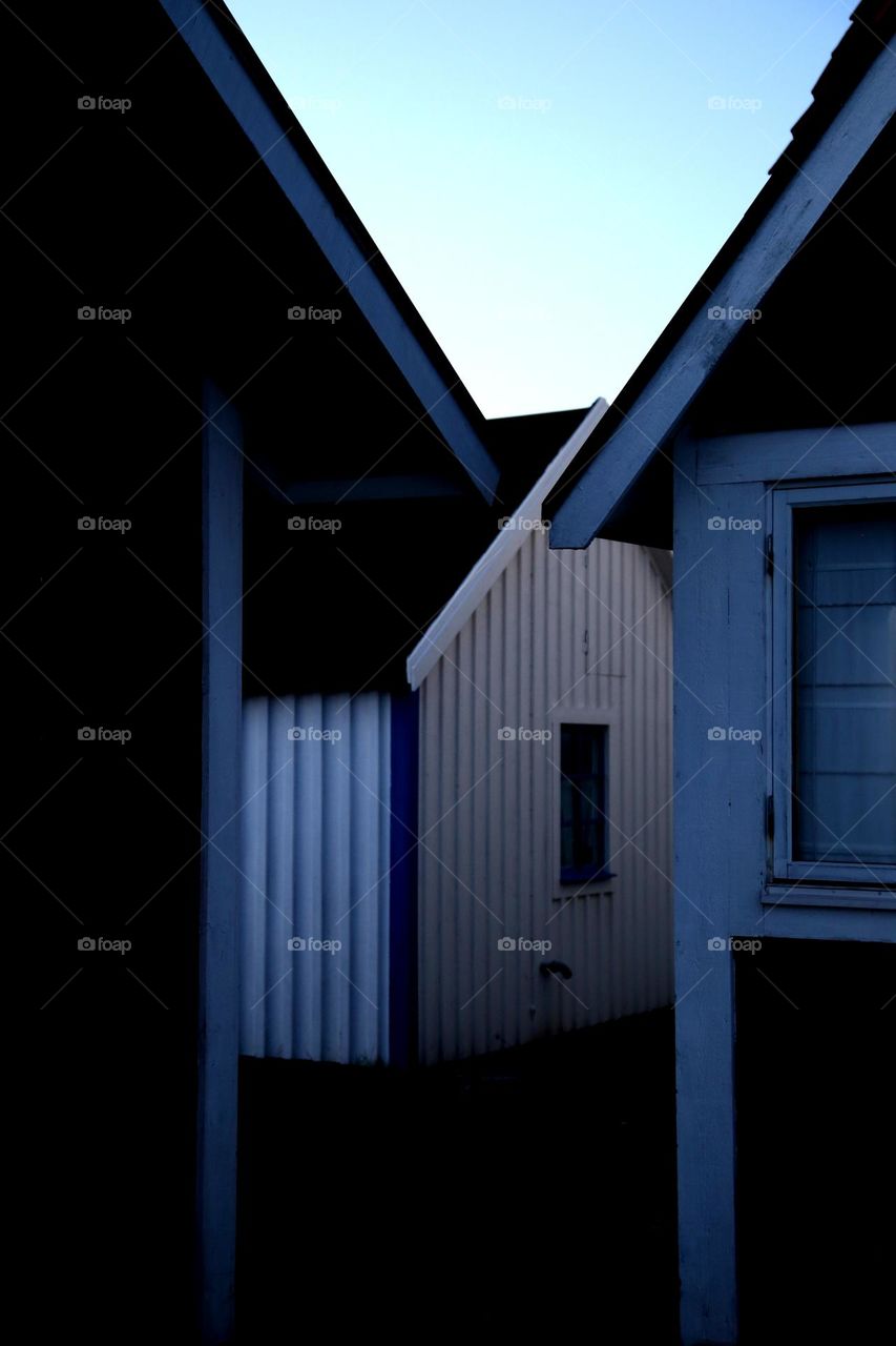 Small wooden buildings standing together 