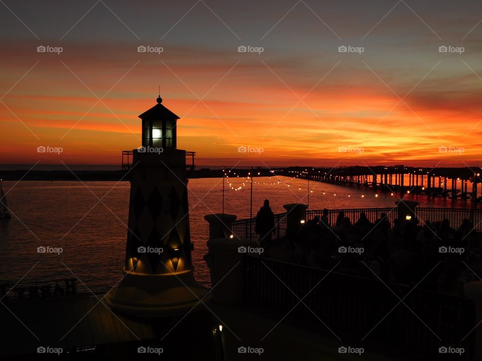 Silhouette of lighthouse during sunset