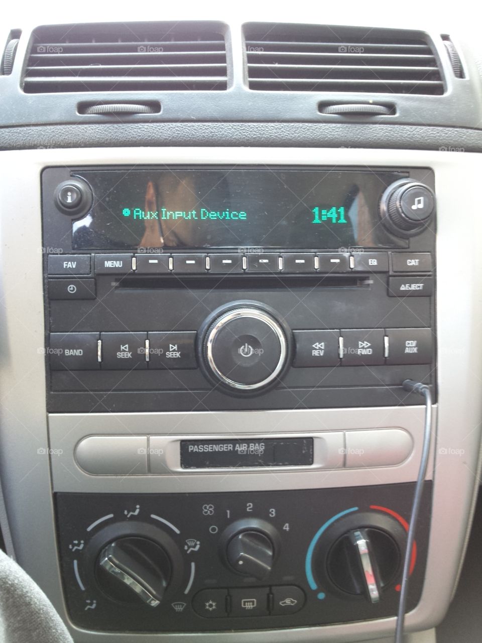 Car radio, in a car.