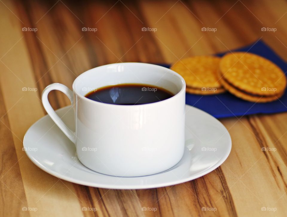black coffee with cookie