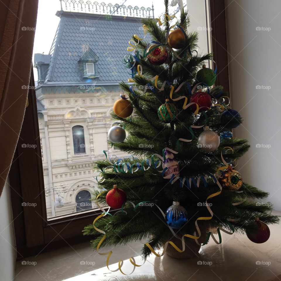 Christmas tree decorated with toys.