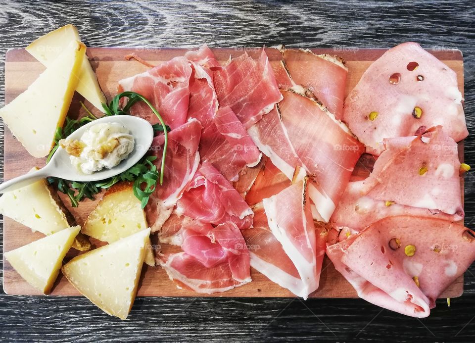 chopping board of cold cuts