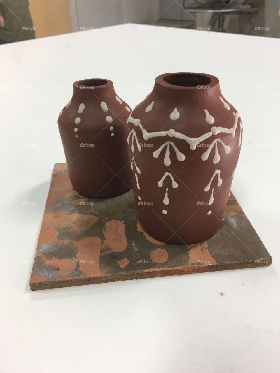 Slip trailing on stoneware handmade pottery 