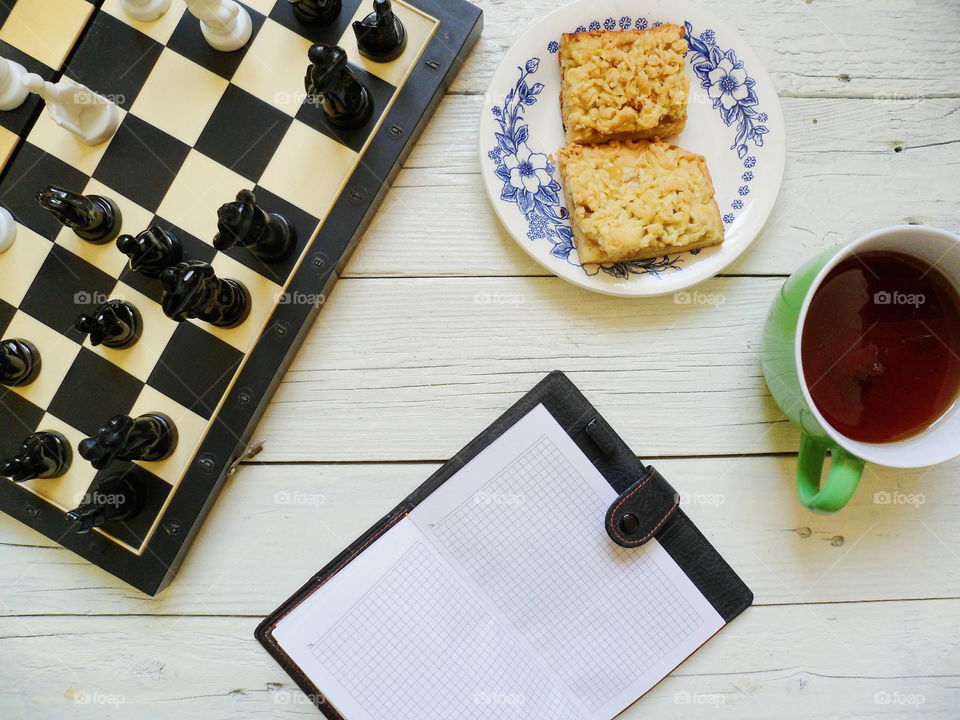 chess, apple pie, a cup of tea and a notebook