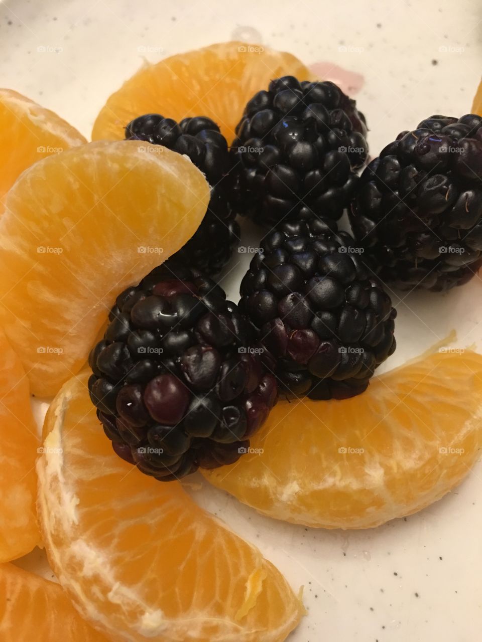 Bright and juicy orange and berries for breakfast