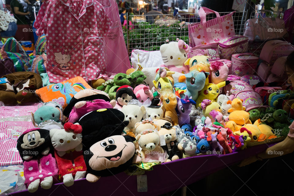 Doll in street market store