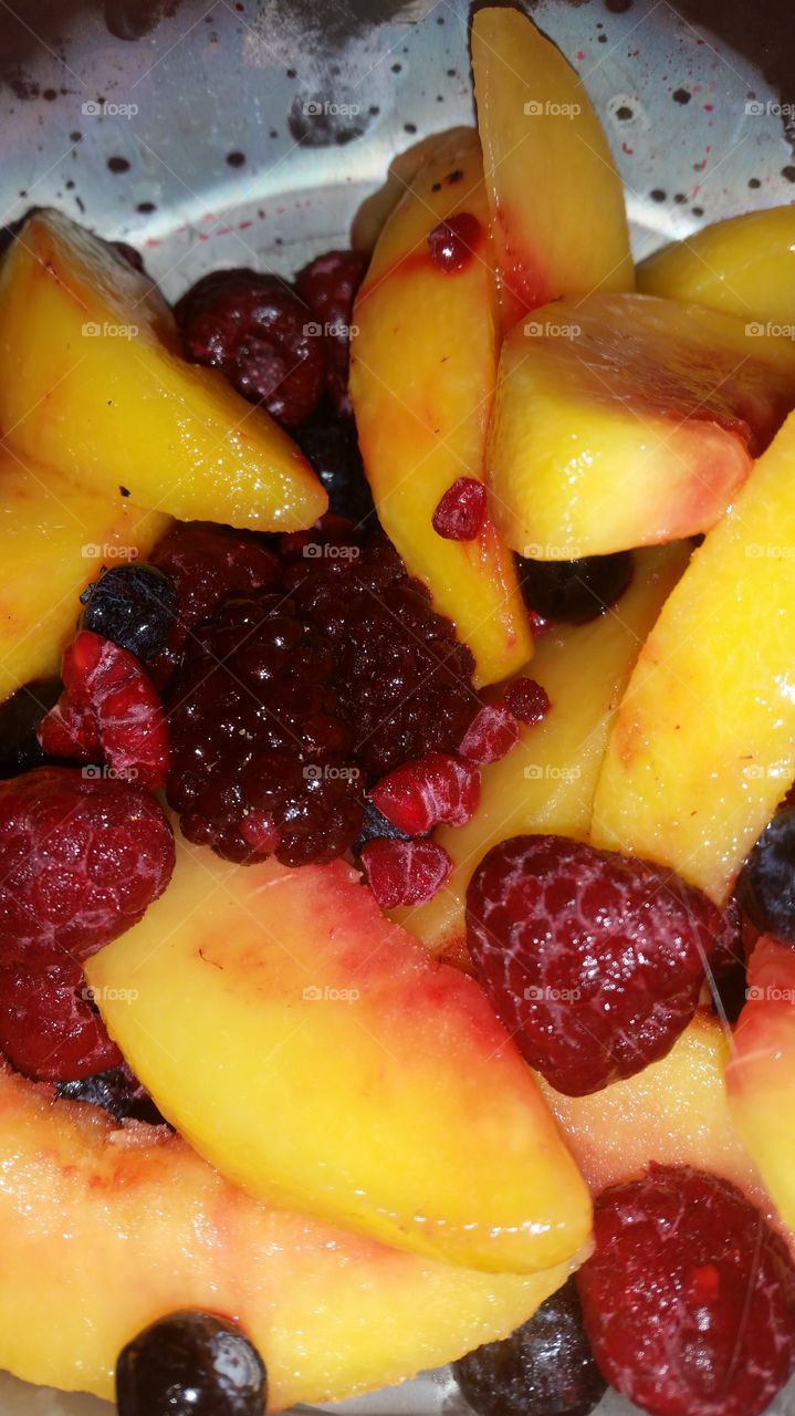 Frozen fruit medley with raspberries, blackberries, blueberries, strawberries, and peaches
