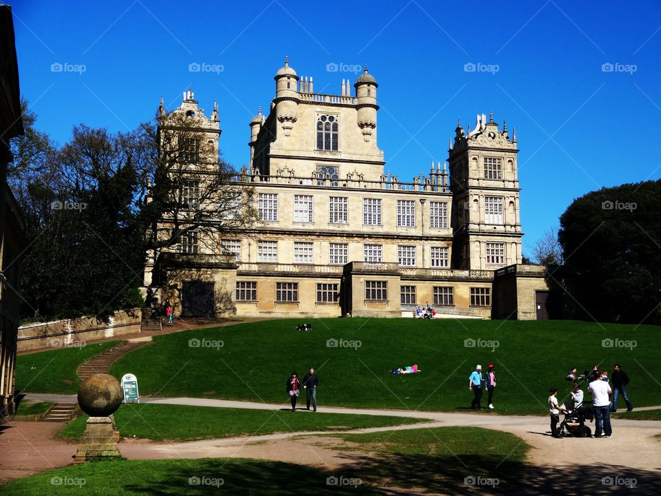 Batman Castle. People enjoying spring in Wollaton Hall and Deer Park in Nottingham