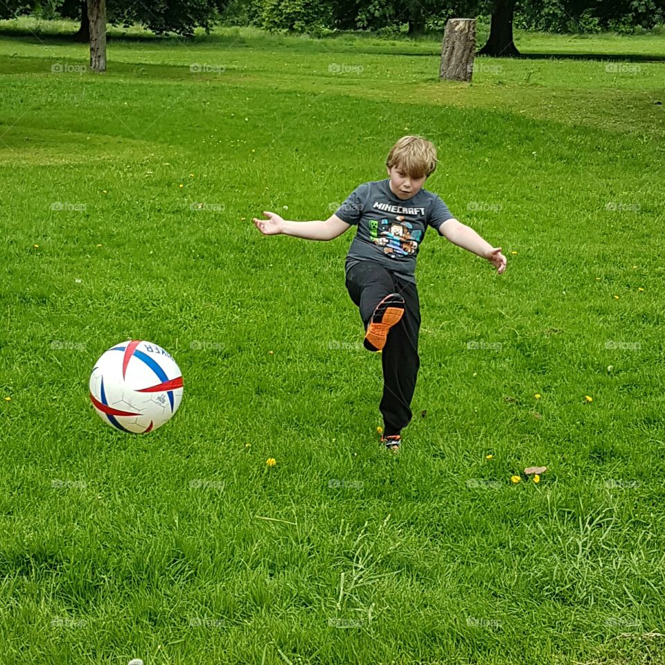 Football in the park. London, UK...