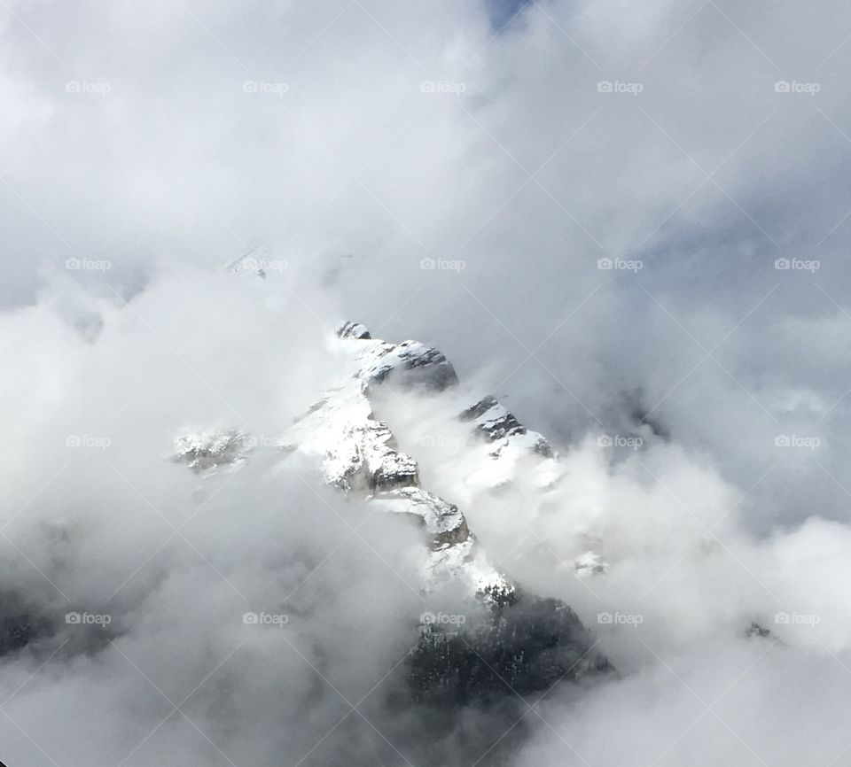 Snowy mountain through the cloud 