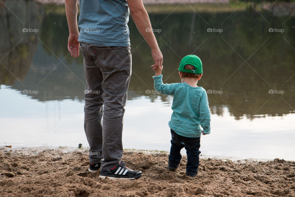 Holding hands with daddy