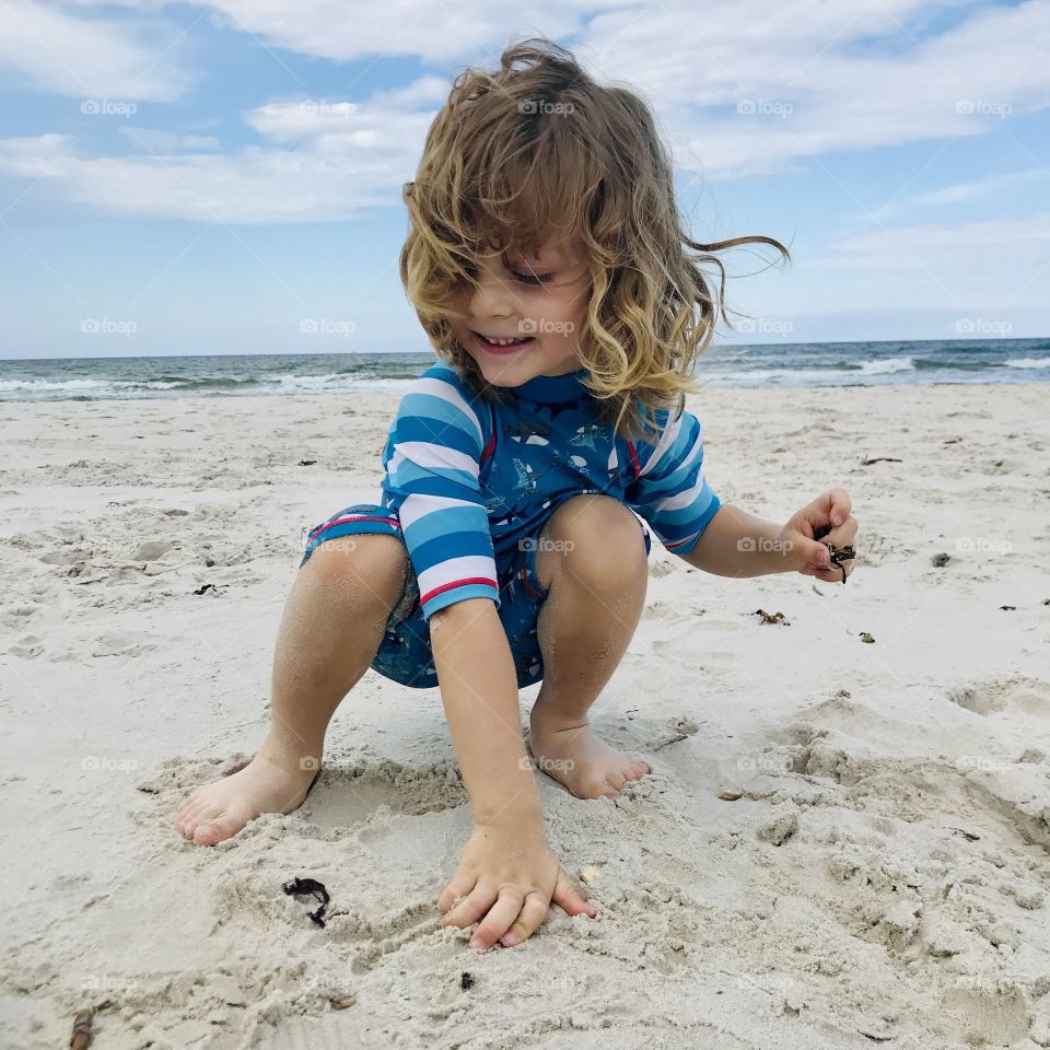 Boy playing on the beach