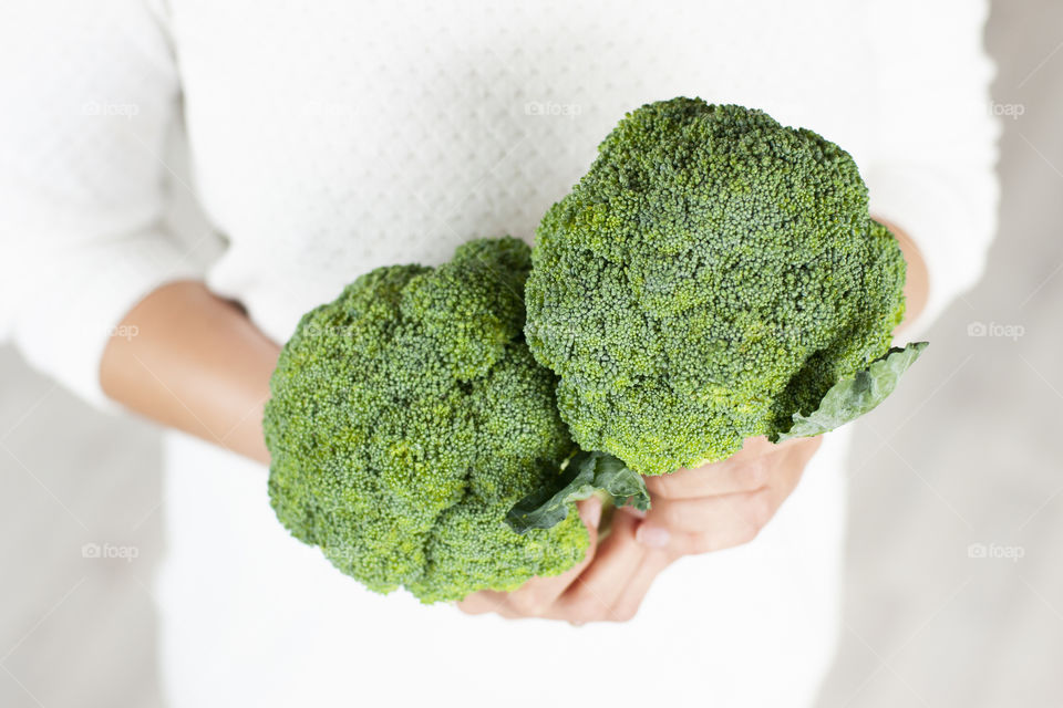 Girl holding broccoli