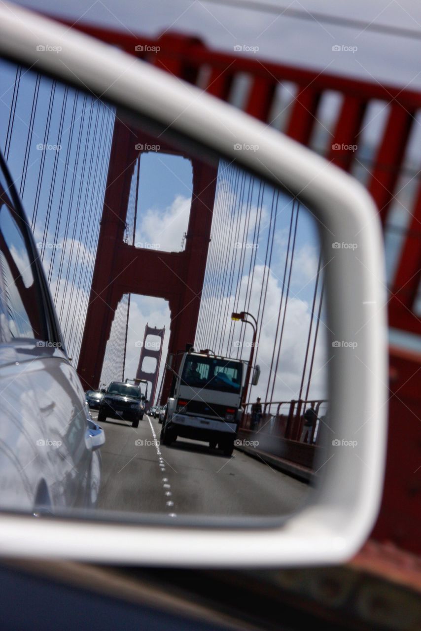 A view of my commute across the Golden Gate Bridge from the side mirror on my car. 