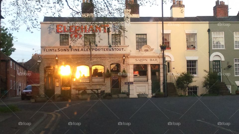 sunset in Faversham kent reflected in Windows elephant pub