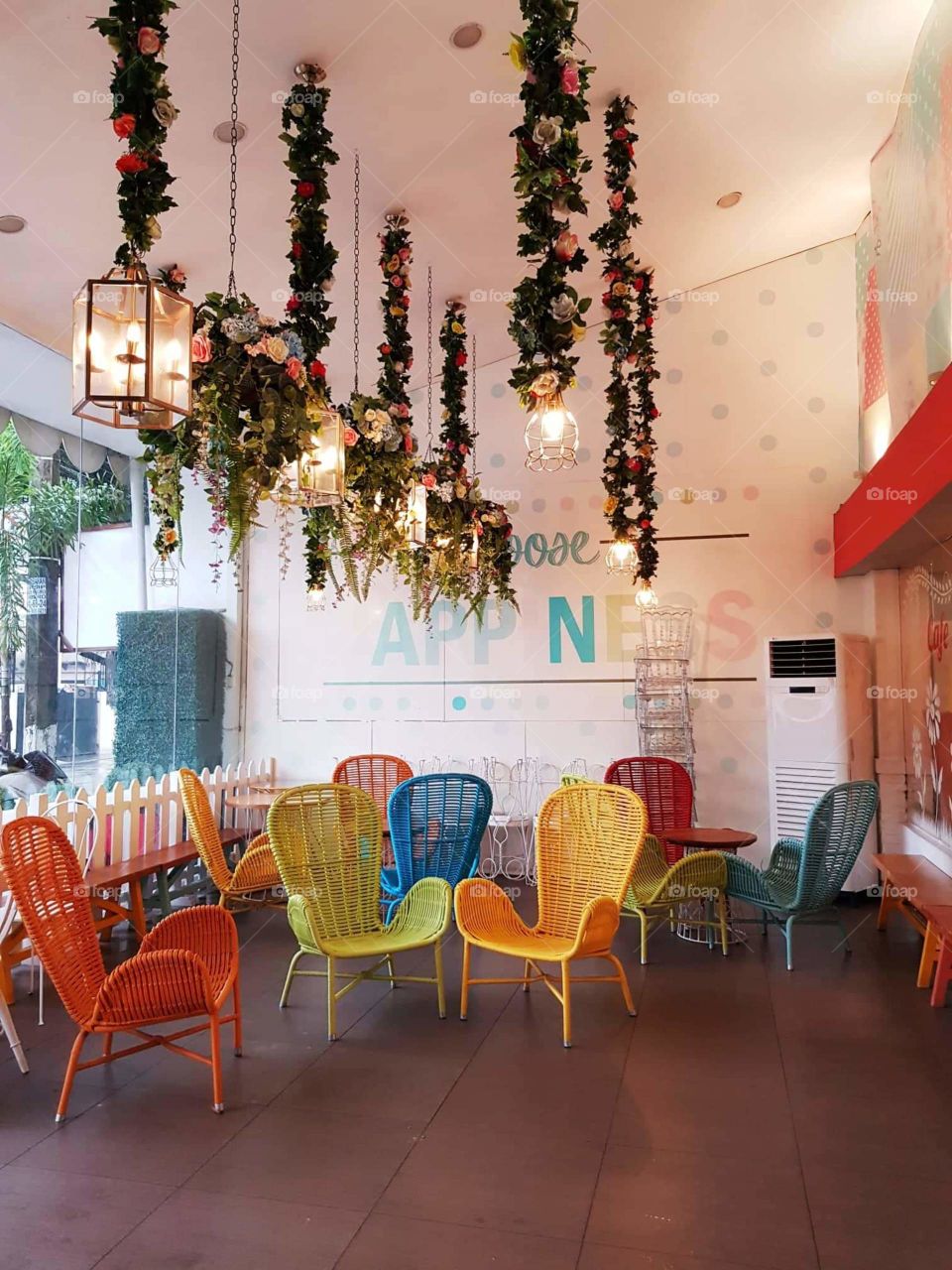Delightful interior design of a resto with its colorful and comfy chairs.